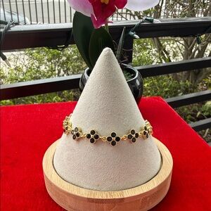 Elegant Gold and Black Floral Bracelet